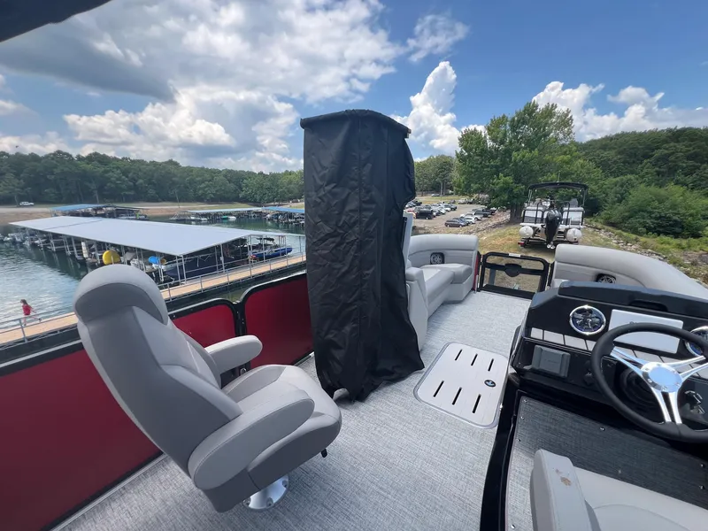 Slide: The Image of 2024 Premier 250 SunSation RF pontoon boat interior with lake view. - 9