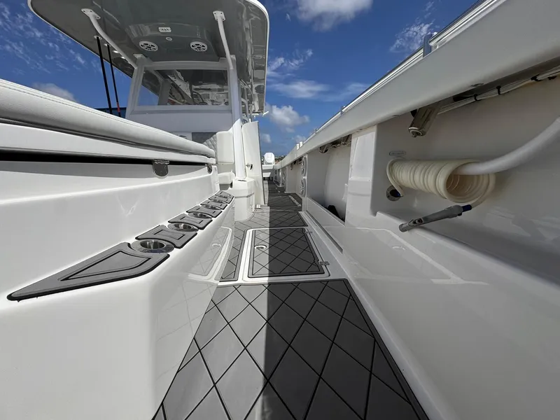 Slide: The Image of 2022 Invincible 46 Catamaran deck view with sleek design and modern features. - 10