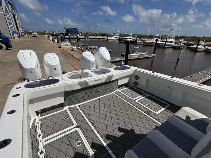 Slide: The Image of Invincible 46 Catamaran 2022 at marina, featuring spacious deck and powerful engines. - 15