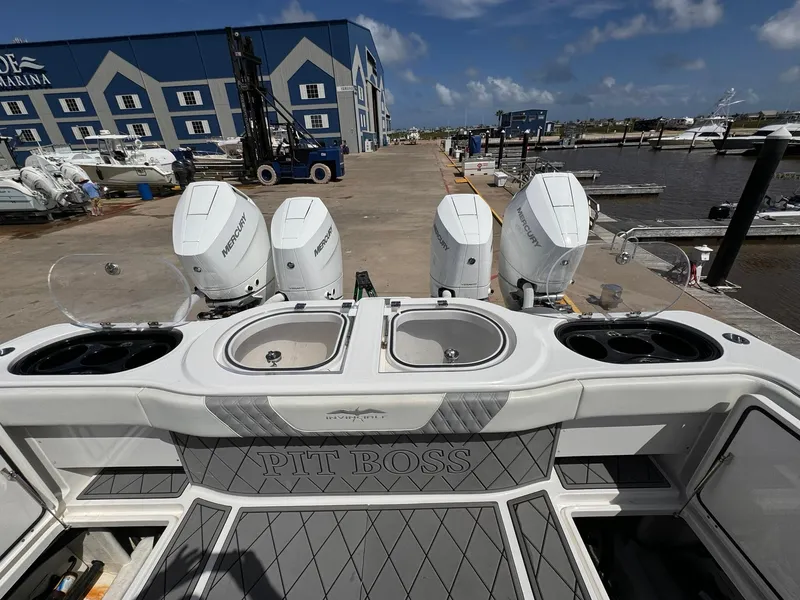 Slide: The Image of Invincible 46 Catamaran 2022 at marina, featuring four powerful outboard engines. - 17