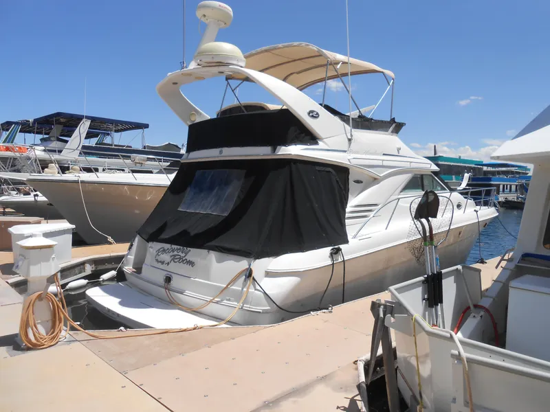 Slide: The Image of 2002 Sea Ray 400 Sedan Bridge yacht docked at marina. - 0