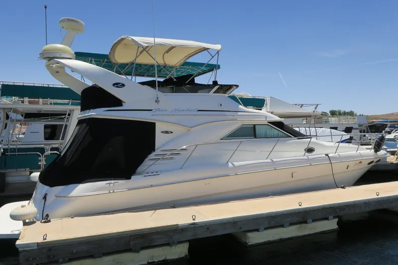 Slide: The Image of 2002 Sea Ray 400 Sedan Bridge yacht docked at marina. - 1