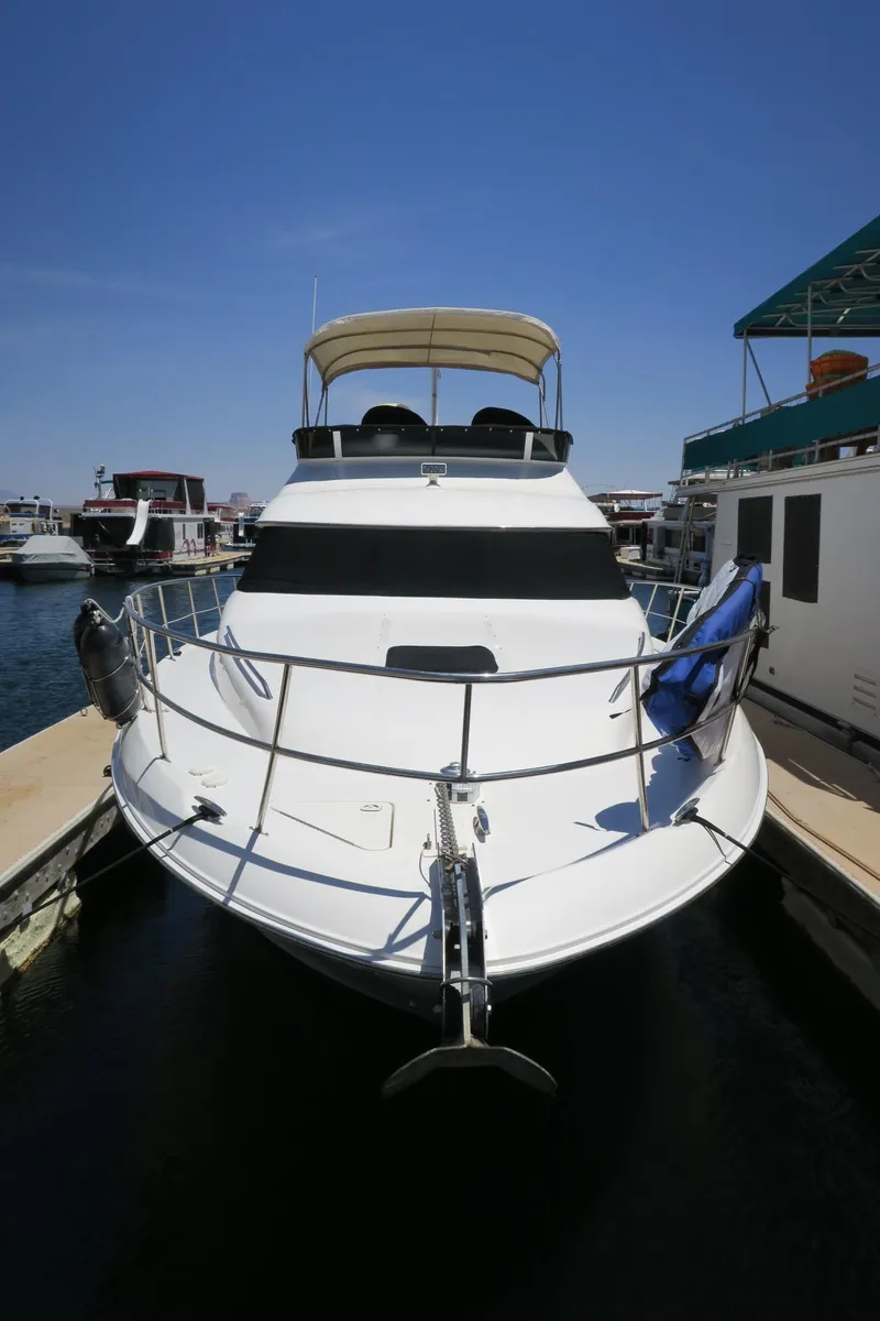 Slide: The Image of 2002 Sea Ray 400 Sedan Bridge docked at marina. - 21