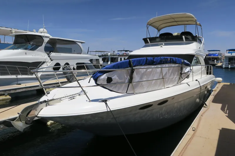 Slide: The Image of 2002 Sea Ray 400 Sedan Bridge yacht docked at marina. - 22