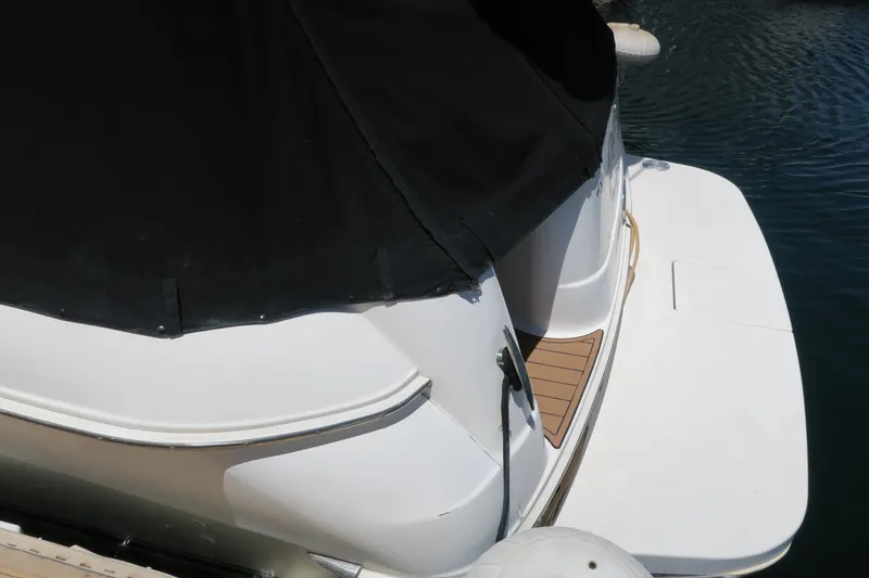 Slide: The Image of 2002 Sea Ray 400 Sedan Bridge rear view at dock. - 23