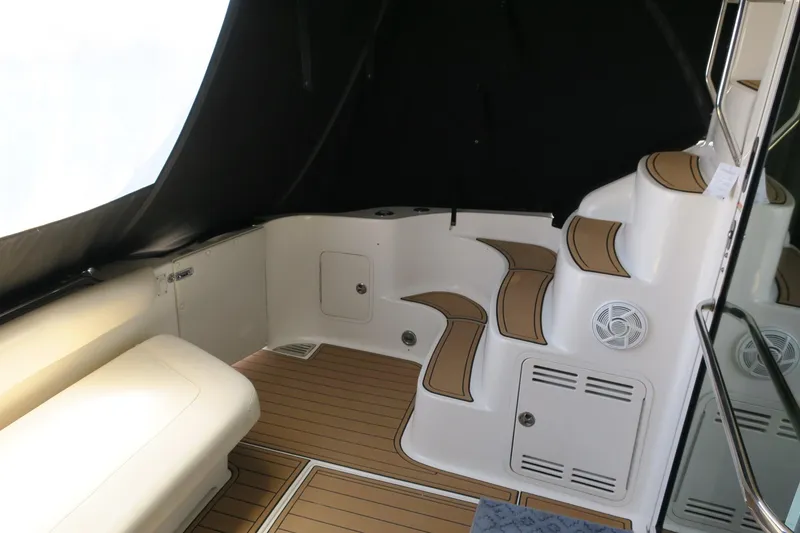 Slide: The Image of Interior of 2002 Sea Ray 400 Sedan Bridge with seating and stairs. - 26