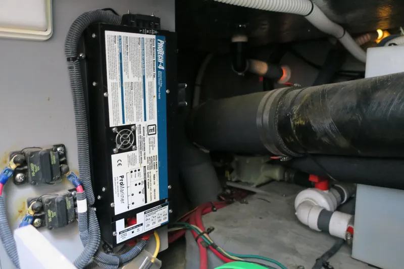 Slide: The Image of Electrical system components in the engine room of a 2002 Sea Ray 400 Sedan Bridge. - 33