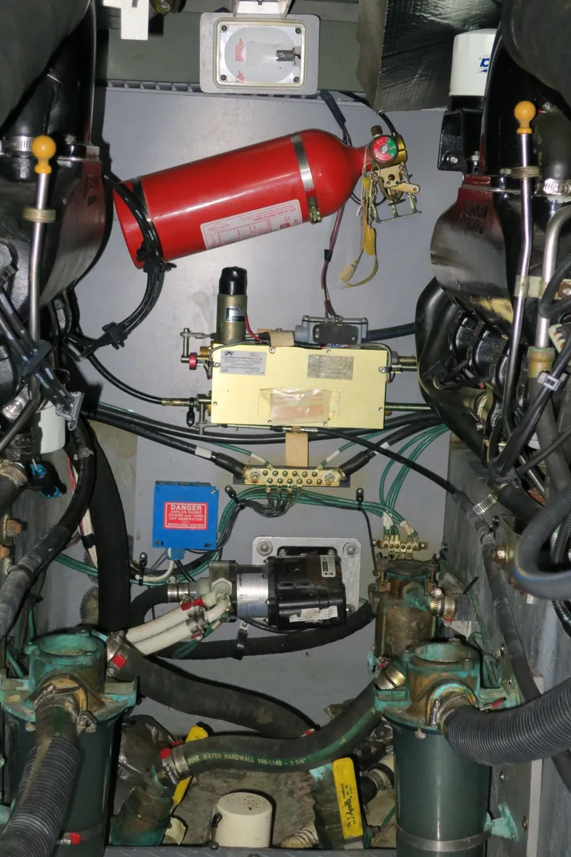 Slide: The Image of Engine room of a 2002 Sea Ray 400 Sedan Bridge yacht with fire extinguisher. - 34