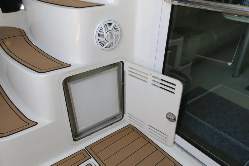 Slide: The Image of 2002 Sea Ray 400 Sedan Bridge boat interior with open storage compartment. - 39