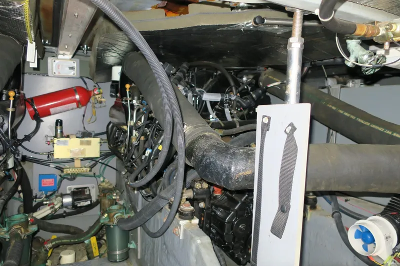 Slide: The Image of Engine room of a 2002 Sea Ray 400 Sedan Bridge yacht with various mechanical components. - 9