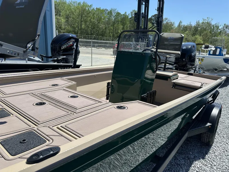 Slide: The Image of 2025 Thor LAKE HAMMER 1900 CC boat with dual outboard motors, parked on gravel. - 5