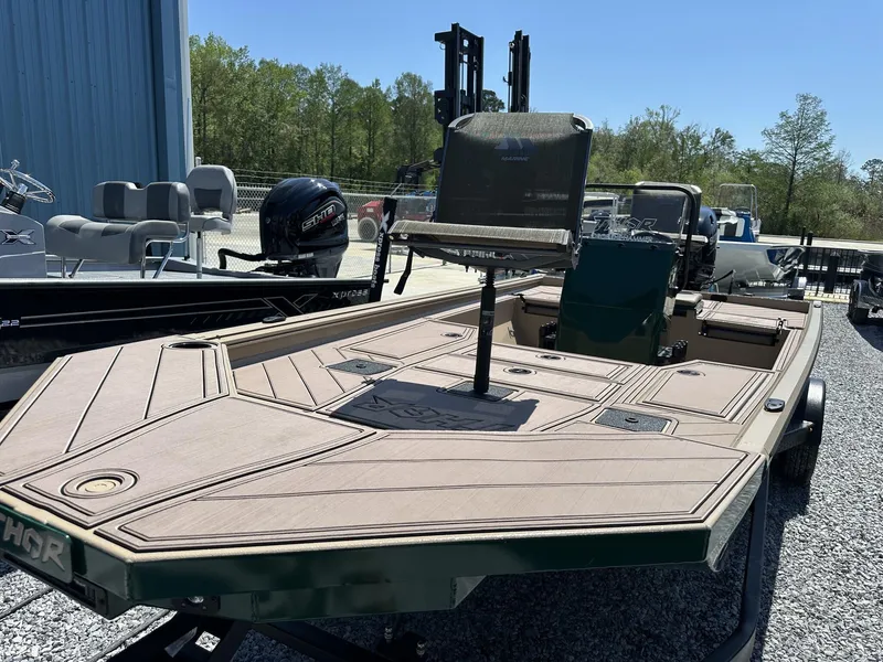 Slide: The Image of 2025 Thor LAKE HAMMER 1900 CC boat displayed outdoors on gravel. - 6