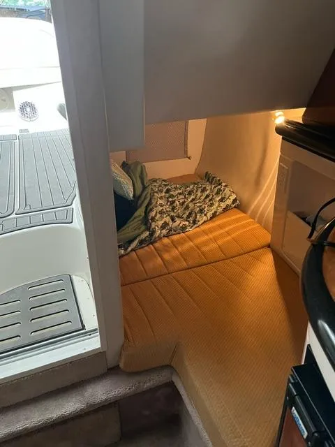 Slide: The Image of Interior cabin of a 2003 Monterey 298 SC Cruiser with cozy bedding. - 3