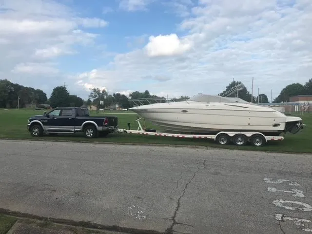 Slide: The Image of Truck towing a 2003 Monterey 298 SC Cruiser boat on a trailer. - 8
