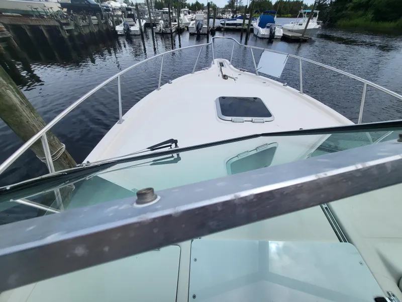 Slide: The Image of 2001 Pursuit 2860 Denali boat docked at marina, view from helm. - 17