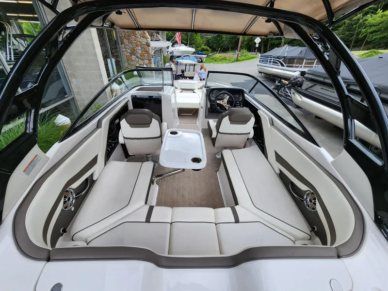 Slide: The Image of 2016 Yamaha Boats 242 Limited S interior with spacious seating and sleek design. - 10