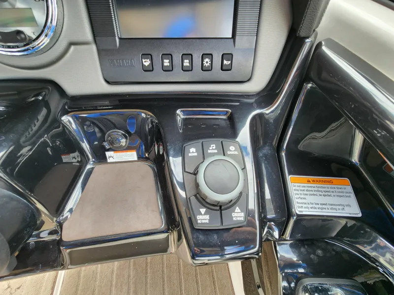 Slide: The Image of Control panel of 2016 Yamaha Boats 242 Limited S with navigation and audio controls. - 17