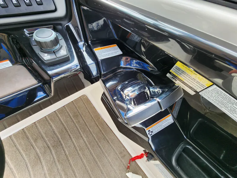 Slide: The Image of 2016 Yamaha Boats 242 Limited S interior controls and dashboard detail. - 18