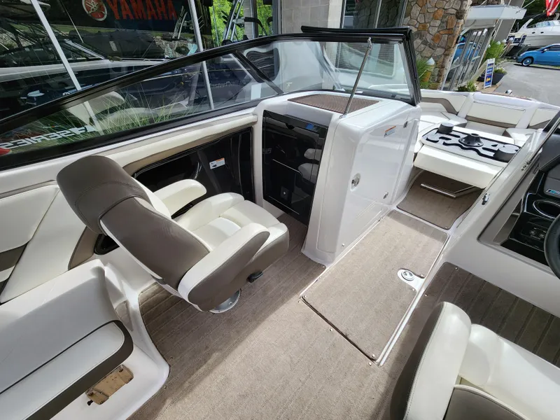 Slide: The Image of 2016 Yamaha Boats 242 Limited S interior with seating and helm. - 19