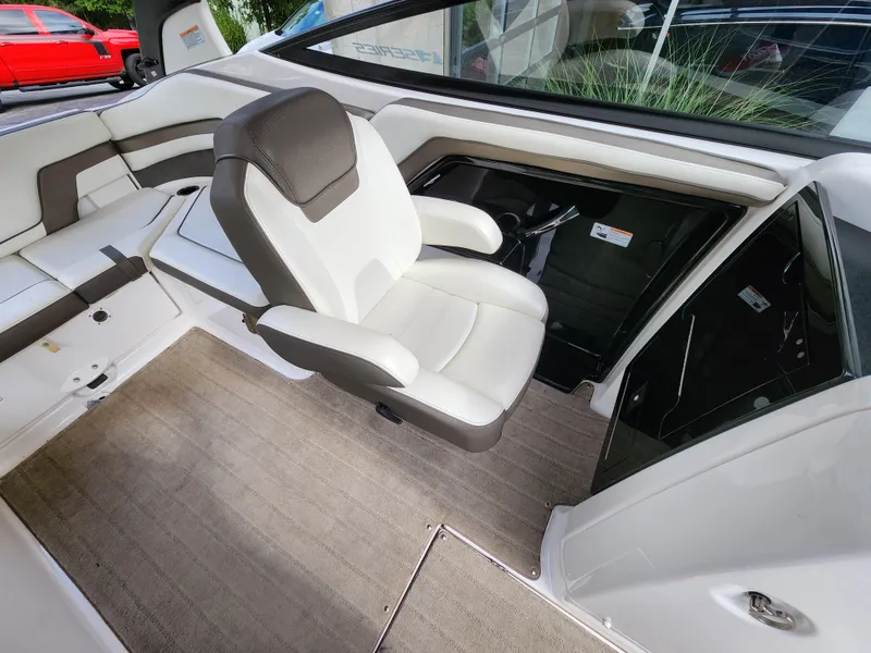 Slide: The Image of 2016 Yamaha Boats 242 Limited S interior with white and gray seating. - 20
