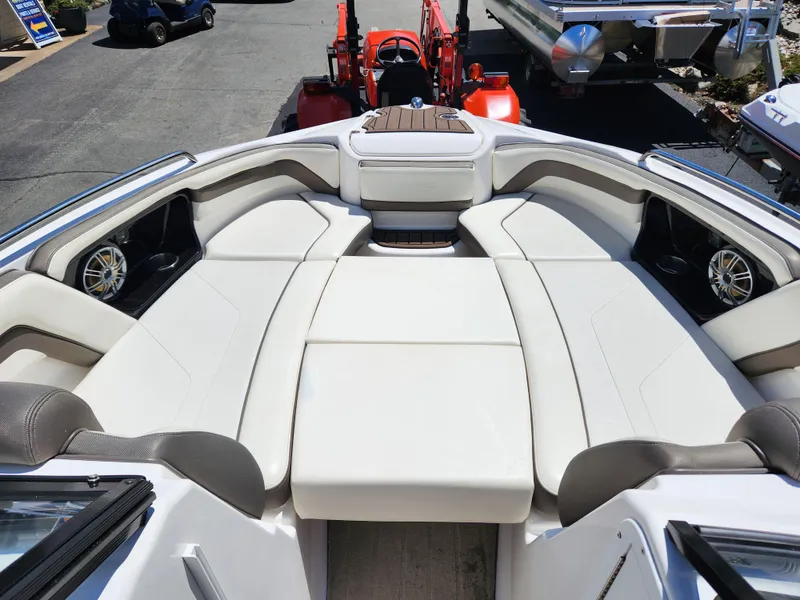 Slide: The Image of 2016 Yamaha Boats 242 Limited S interior with spacious seating and sleek design. - 21
