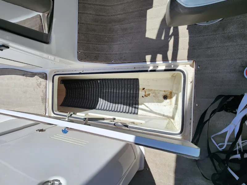 Slide: The Image of Open storage compartment on 2016 Yamaha Boats 242 Limited S. - 24