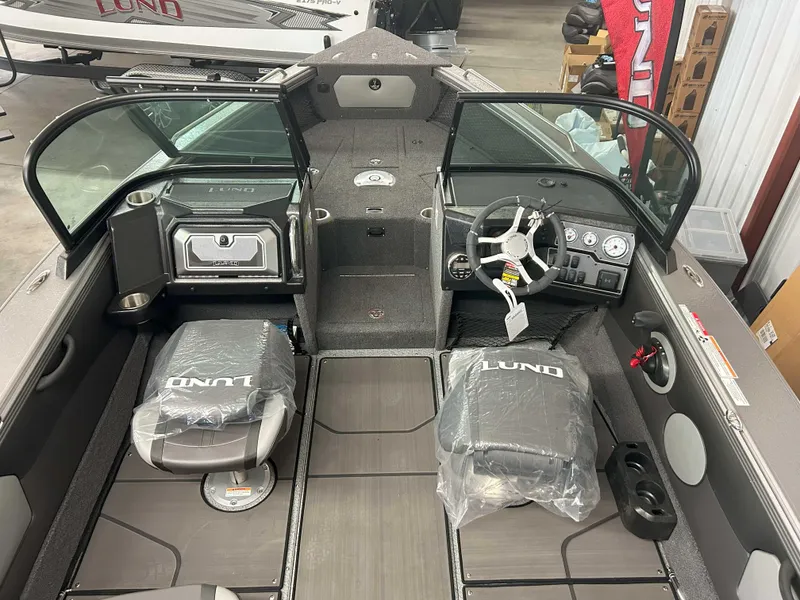 Slide: The Image of Interior of 2025 Lund 1975 Tyee boat with modern dashboard and seating. - 3