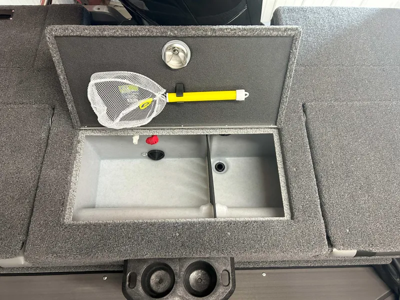 Slide: The Image of Fishing gear storage in 2025 Lund 1975 Tyee boat, featuring net and compartments. - 6