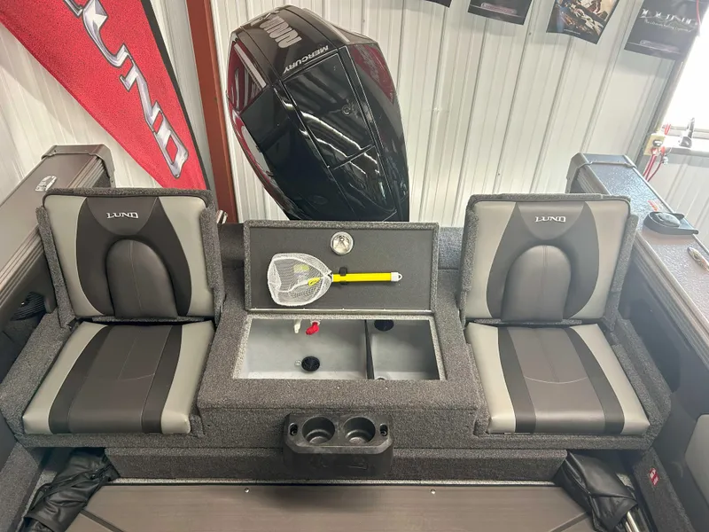 Slide: The Image of Interior of 2025 Lund 1975 Tyee boat with seating and storage compartments. - 7