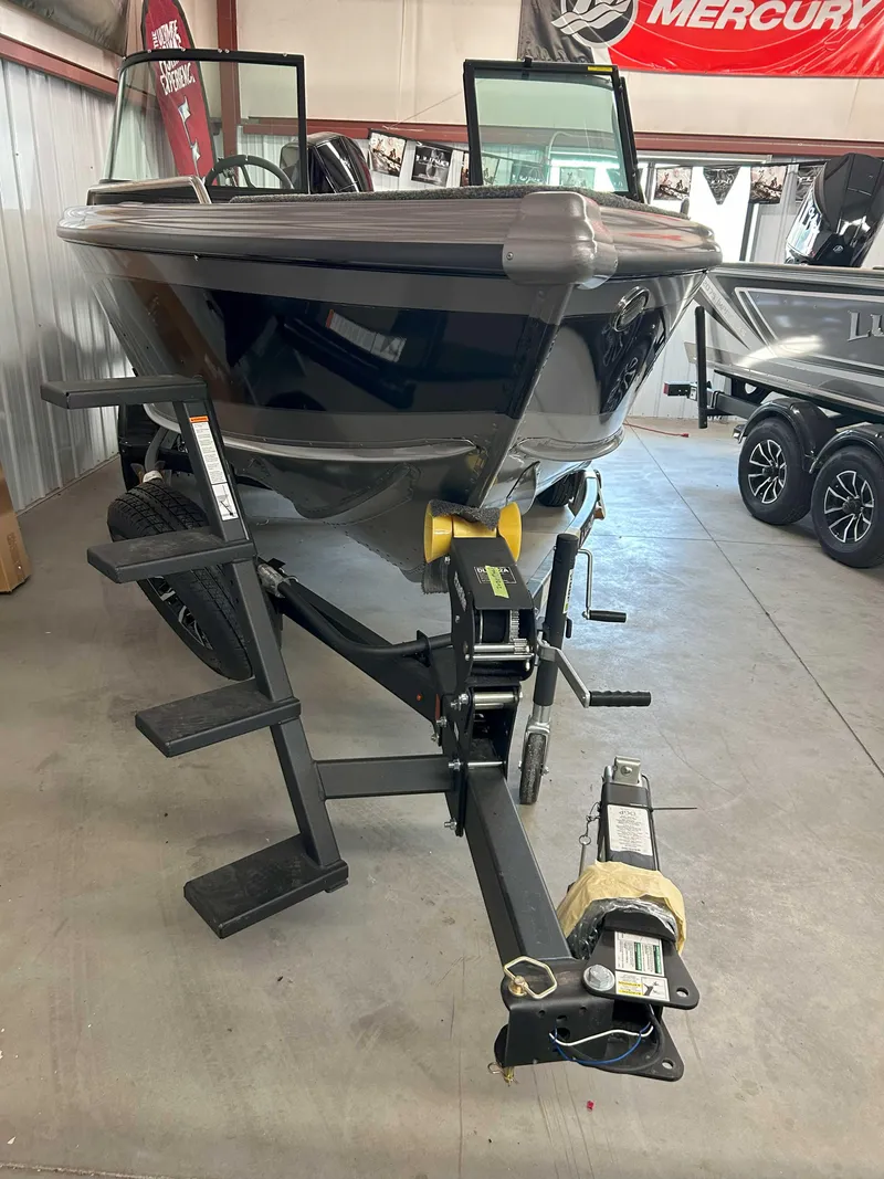 Slide: The Image of 2025 Lund 1975 Tyee boat on trailer in showroom. - 8