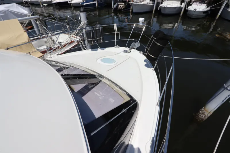 Slide: The Image of 2007 Carver 35 Super Sport yacht docked at a marina. - 11