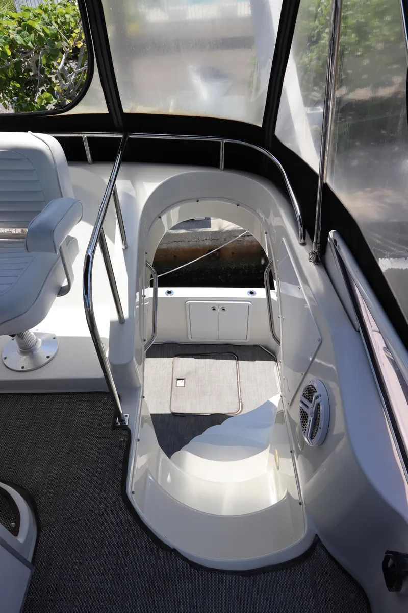 Slide: The Image of 2007 Carver 35 Super Sport boat interior with stairs and seating area. - 15