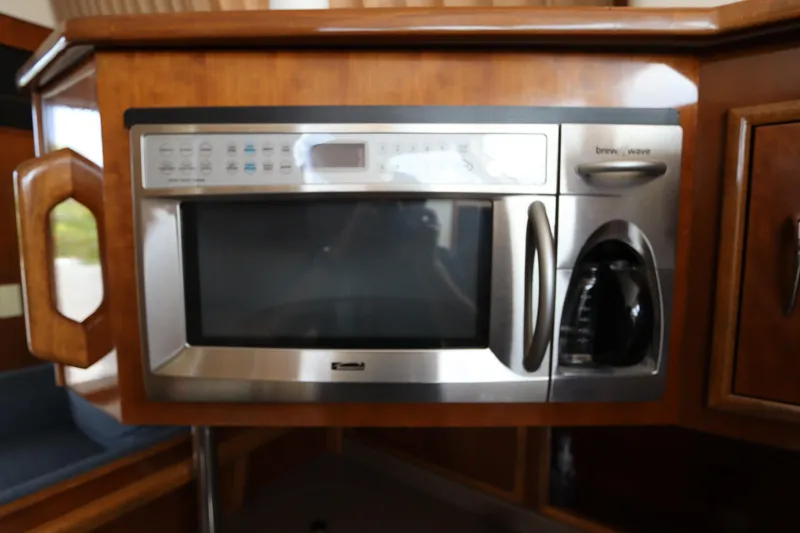 Slide: The Image of Built-in microwave and coffee maker in 2007 Carver 35 Super Sport yacht kitchen. - 28
