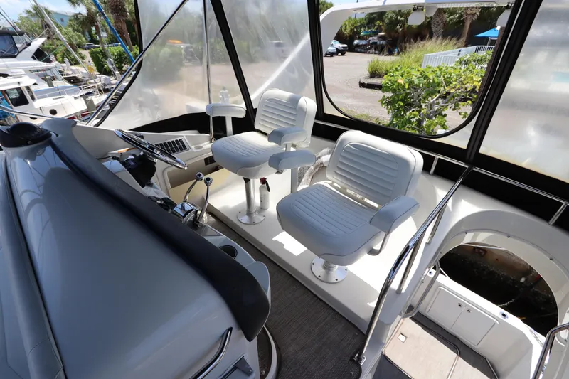 Slide: The Image of 2007 Carver 35 Super Sport yacht helm with dual captain chairs. - 18