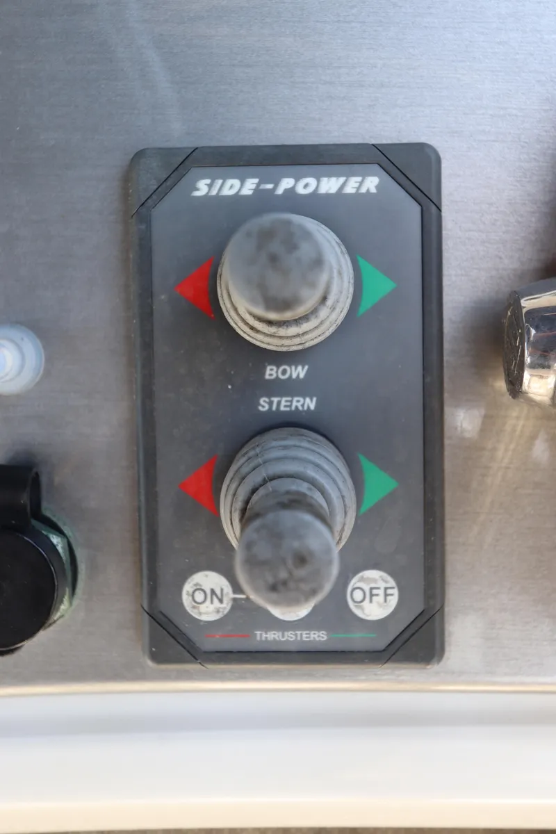 Slide: The Image of Control panel for bow and stern thrusters on a 2007 Carver 35 Super Sport. - 22