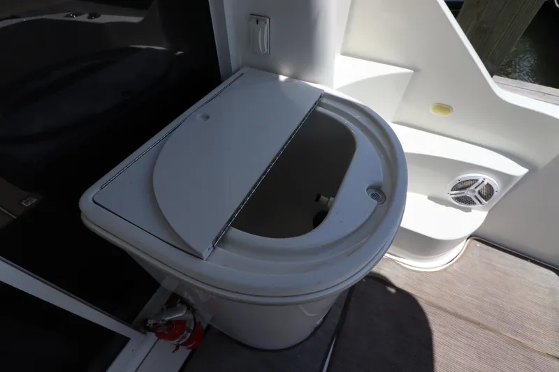 Slide: The Image of 2007 Carver 35 Super Sport boat sink and storage compartment. - 9