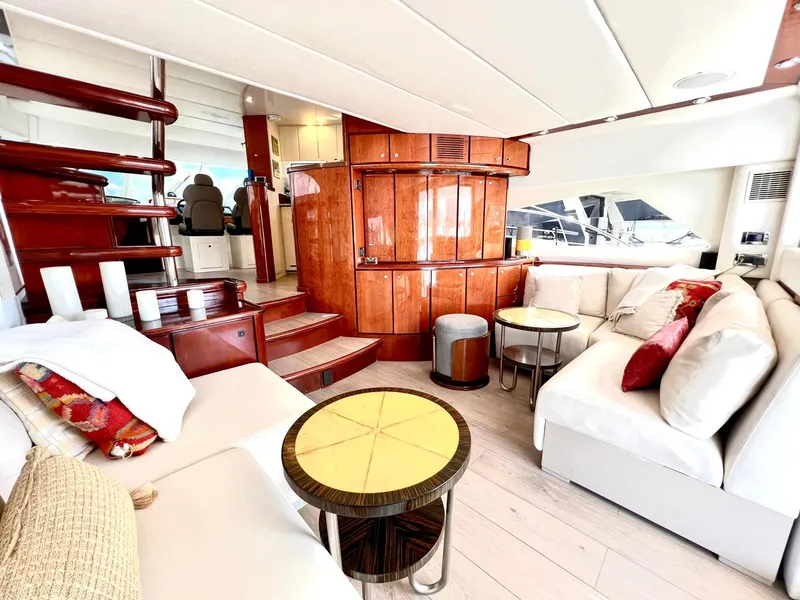 Slide: The Image of Luxurious interior of 1999 Fairline Squadron 65 yacht with elegant seating and wooden finishes. - 10