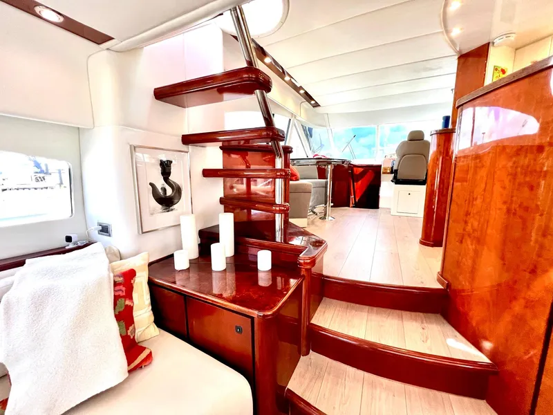 Slide: The Image of Luxurious interior of a 1999 Fairline Squadron 65 yacht with wooden stairs and modern decor. - 11