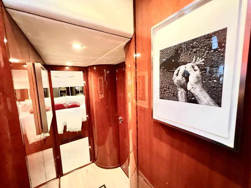 Slide: The Image of Interior hallway of 1999 Fairline Squadron 65 yacht with framed artwork. - 19