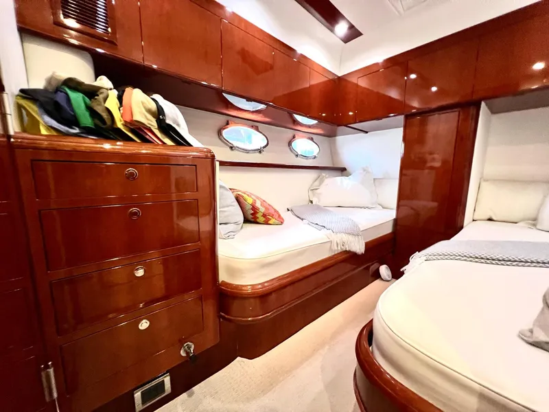Slide: The Image of Luxurious cabin interior of 1999 Fairline Squadron 65 yacht with wooden cabinetry and twin beds. - 24