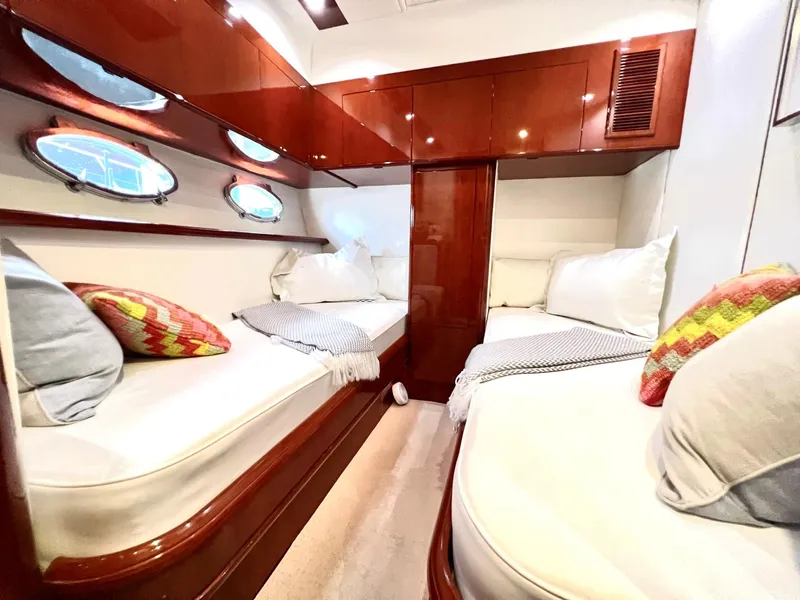 Slide: The Image of Luxurious cabin interior of 1999 Fairline Squadron 65 yacht with twin beds and portholes. - 25