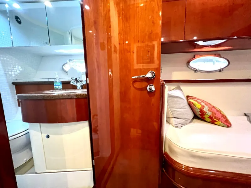 Slide: The Image of Interior of 1999 Fairline Squadron 65 yacht with wooden finishes and cozy cabin. - 26