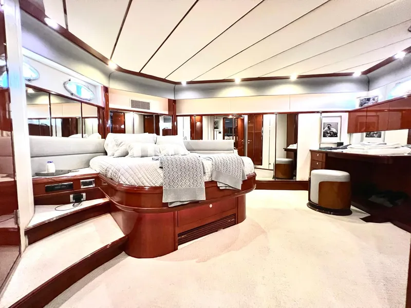 Slide: The Image of Luxurious master bedroom on 1999 Fairline Squadron 65 yacht with elegant wood finishes. - 29
