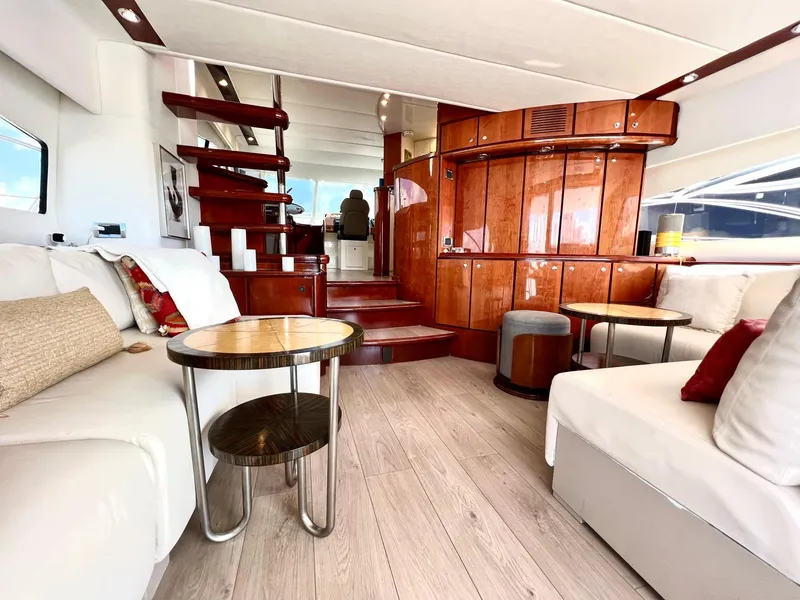 Slide: The Image of Luxurious interior of 1999 Fairline Squadron 65 yacht with modern furnishings and wooden accents. - 9