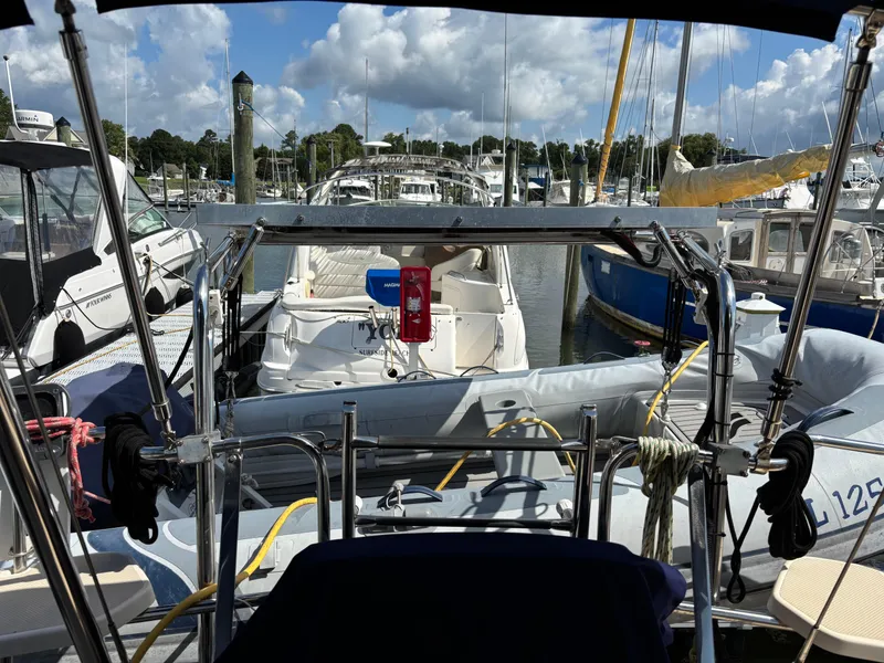 Slide: The Image of Marina view from 1999 Island Packet 350 sailboat, surrounded by other boats under a cloudy sky. - 11