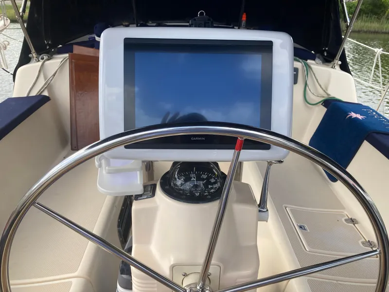 Slide: The Image of Steering wheel and navigation system on 1999 Island Packet 350 sailboat. - 4