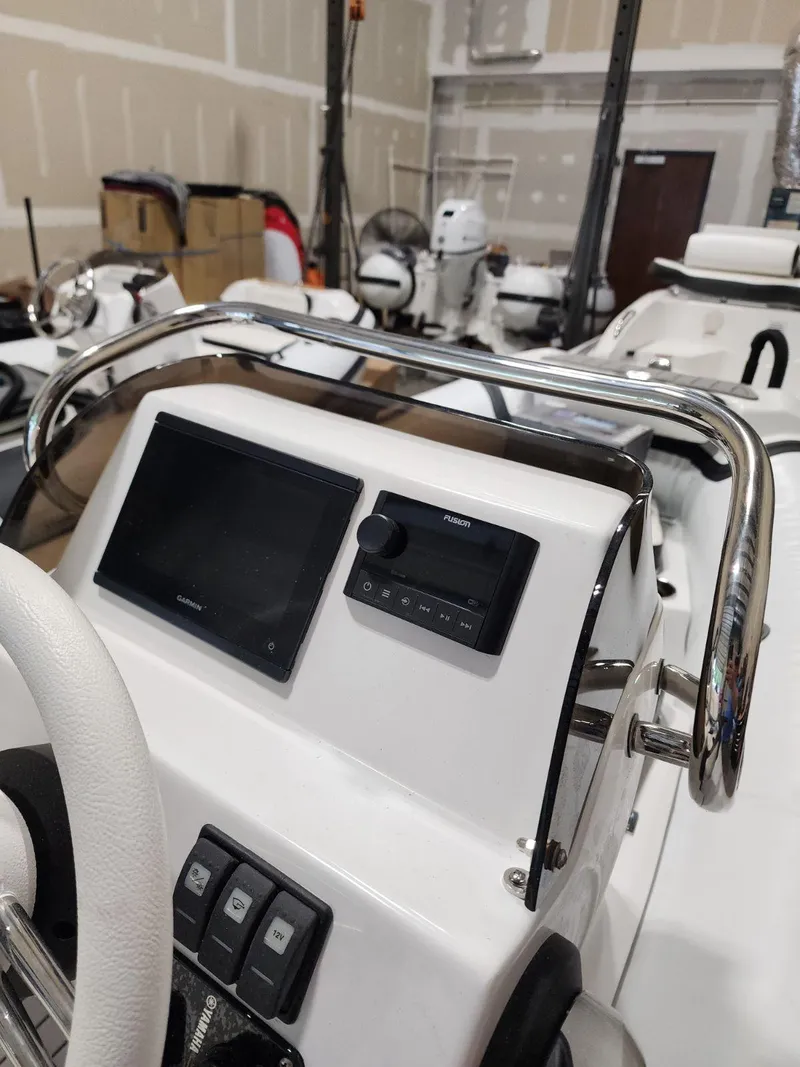 Slide: The Image of 2025 Walker Bay Generation 13 LTE boat dashboard with navigation controls. - 4