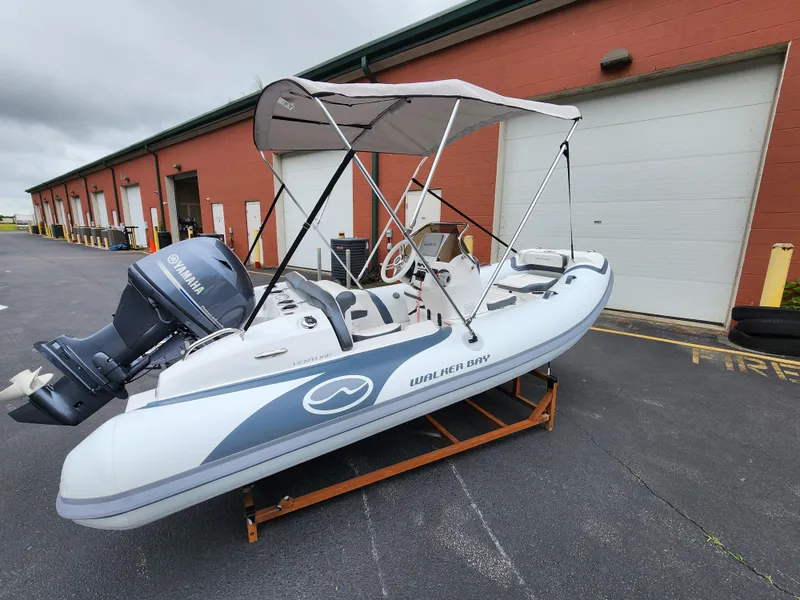 The Image of 2025 Walker Bay Venture 13 boat with Yamaha outboard motor and canopy. - 0