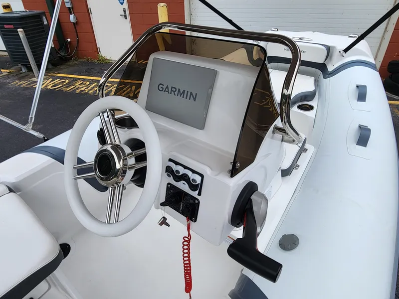 Slide: The Image of Walker Bay Venture 13 (2025) boat console with Garmin navigation system. - 5