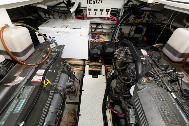 Slide: The Image of Engine room of a 2004 Cruisers Yachts 370 Express with twin engines and Onan generator. - 16